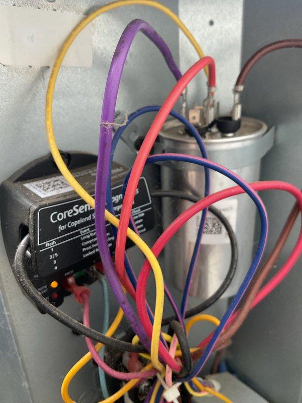Completed comprehensive cooling system maintenance on residential HVAC unit. Performed thorough inspection of P.K. Wadsworth furnace and air handler system, including electrical diagnostics using CoreSense monitoring device for Copeland compressor components. Verified proper capacitor operation, tested electrical connections with multi-meter leads, and confirmed all safety controls and warning systems functioning correctly.