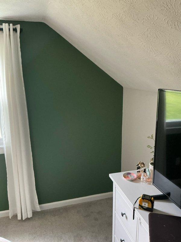 Conducted on-site assessment for mini split installation on the top floor of a bi-level residence requiring single-head indoor unit. Performed room measurements and evaluated electrical requirements for proper system sizing and placement in the sloped ceiling space with accent wall features.