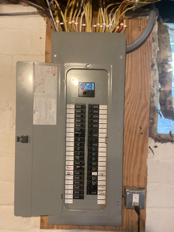 Conducted comprehensive electrical inspection of residential property to assess generator installation requirements and evaluate existing electrical panel condition. Documented proposed generator placement location in yard adjacent to existing HVAC unit, measuring and marking optimal positioning for code-compliant installation with proper clearances from structure and utilities. Inspected main electrical panel box in unfinished interior space, noting current circuit configuration, available capacity, and assessing compatibility for generator transfer switch integration. Captured detailed photographic documentation of site conditions, existing electrical infrastructure, and recommended installation pathway to support accurate generator system quotation and panel upgrade specifications.