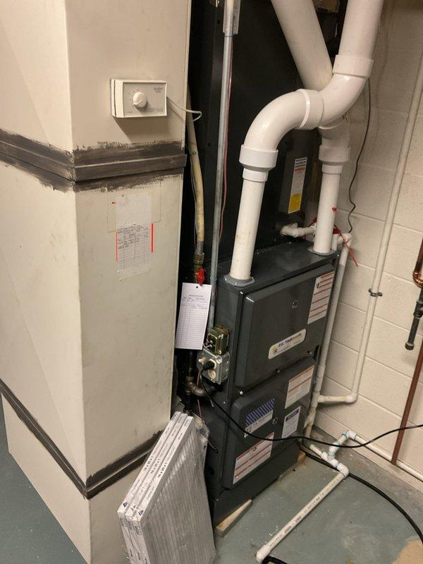 Performed comprehensive cooling system maintenance on residential HVAC unit. Conducted electrical diagnostics using clamp meter to verify amperage draw and system performance, inspected furnace components and labeling, and evaluated air filtration system. All equipment found to be in operational condition with no immediate service needs identified.