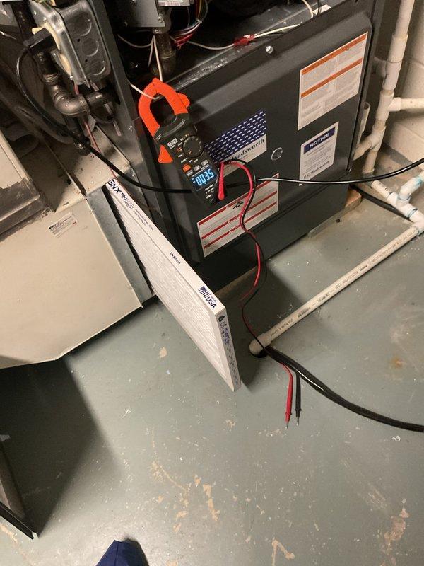 Performed comprehensive cooling system maintenance on residential HVAC unit. Conducted electrical diagnostics using clamp meter to verify amperage draw and system performance, inspected furnace components and labeling, and evaluated air filtration system. All equipment found to be in operational condition with no immediate service needs identified.