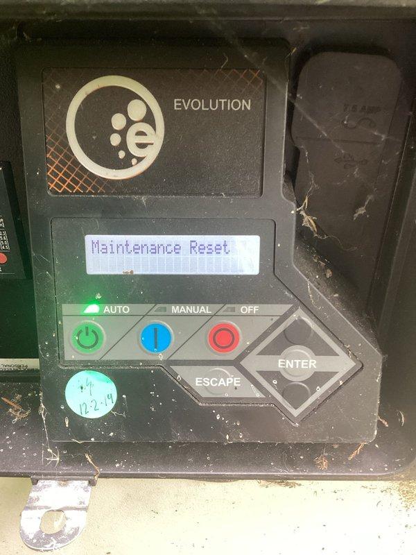 Performed scheduled maintenance on commercial Generac Evolution series generator. Completed maintenance reset procedure via control panel interface. Inspected alternator assembly, verified proper operation of cooling vents and electrical connections. Replaced engine oil filter with genuine Generac part (0A45310244), documented filter change date, and checked all fluid levels. Cleaned control panel exterior and verified AUTO/MANUAL/OFF selector functions operating correctly.