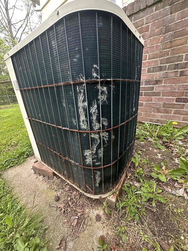 Conducted hail damage assessment on residential outdoor condensing unit. Unit exhibited significant exterior deterioration including weathered casing, corroded refrigerant lines, and damaged condenser grille with visible impact marks. Documented damage with photographs and provided repair estimate for insurance claim purposes.