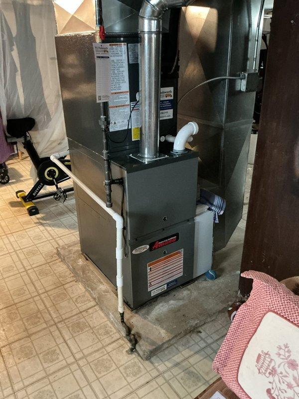 Responded to service call regarding water dripping from pipes following new furnace/AC installation. Upon inspection, identified issue with condensate drainage system connected to the Amana furnace unit. Verified PVC condensate drain line configuration and connections, checked for proper pitch and drainage flow, and ensured all fittings were secure to eliminate water leakage at pipe connections.