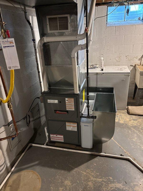 Completed installation of high-efficiency 97% AFUE furnace system in residential basement mechanical room, including all necessary venting, gas line connections, and ductwork integration. Installed exterior PVC intake and exhaust terminations through foundation wall per manufacturer specifications, ensuring proper clearances and weatherproofing. System tested and verified operational with all safety controls functioning correctly.