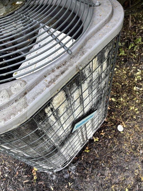 Performed coil wash service on outdoor condensing unit. Condenser coils were heavily soiled with accumulated dirt, debris, and organic matter causing reduced airflow and efficiency. Thoroughly cleaned and washed condenser coils to restore proper heat transfer and system performance.