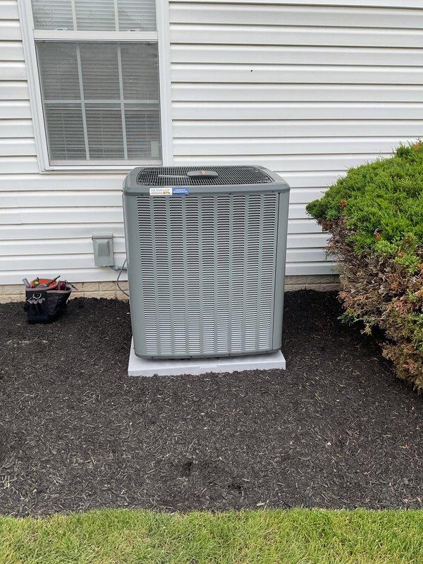 # HVAC Cooling Maintenance Completed

Performed annual preventive maintenance service on residential split-system air conditioning unit as part of scheduled maintenance agreement. Conducted comprehensive inspection of outdoor condenser unit, which is properly installed on composite pad with adequate clearance from building and landscaping. Unit showed normal operating conditions with no visible damage to cabinet, coil fins, or protective grilles.

Inspected electrical disconnect box and internal components, including CoreSense monitoring device and capacitor. Verified all electrical connections are secure with proper wire management and no signs of overheating or corrosion. System monitoring equipment functioning correctly with all diagnostic connections intact. Capacitor terminals clean and connections tight. All safety disconnects operating properly.

Completed standard maintenance checklist including visual inspection of refrigerant lines, condensate drainage, and overall system con