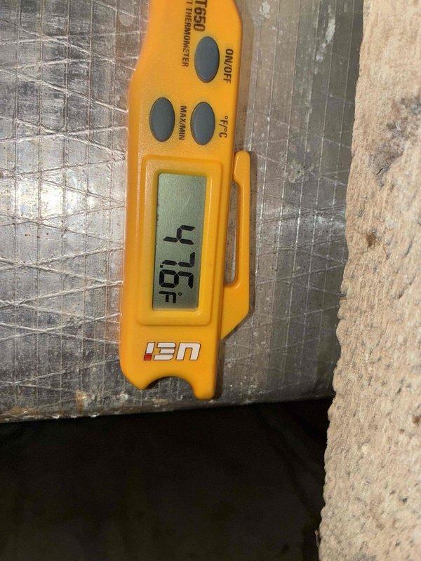 Responded to no-cool call on aging HVAC system where warm air from supply duct was causing condensation and water leakage at drain pan. Performed temperature diagnostics using digital thermometer, measuring supply air temperature at 4.75°F delta, indicating insufficient cooling capacity. Inspected attic-mounted air handler unit, drain lines, and associated PVC condensate piping for proper operation and drainage issues related to inadequate system performance.