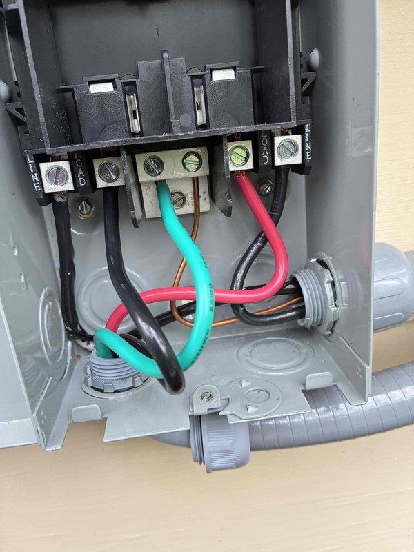 Replaced damaged 60-amp electrical disconnect switch that was bent during initial installation. Removed the compromised disconnect box, installed new unit with proper wiring connections to terminal block, and verified all electrical connections were secure and operational.