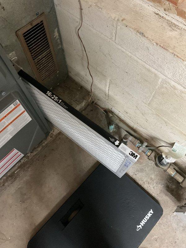 Completed annual preventative maintenance on residential gas furnace as part of scheduled service plan visit. Upon inspection, verified all burners igniting properly with characteristic blue flame pattern, confirmed proper operation of ignition system and flame sensor, and tested safety controls including pressure switches and limit switches. Examined electrical connections throughout the unit, ensuring all wire terminations were secure and showed no signs of overheating or deterioration. Inspected heat exchanger for cracks or signs of failure, checked blower motor operation and capacitor condition, and verified gas valve functionality. All mechanical and electrical components found to be operating within normal parameters with no immediate service needs identified. Documentation photos captured for service records showing active burner operation and overall system condition.