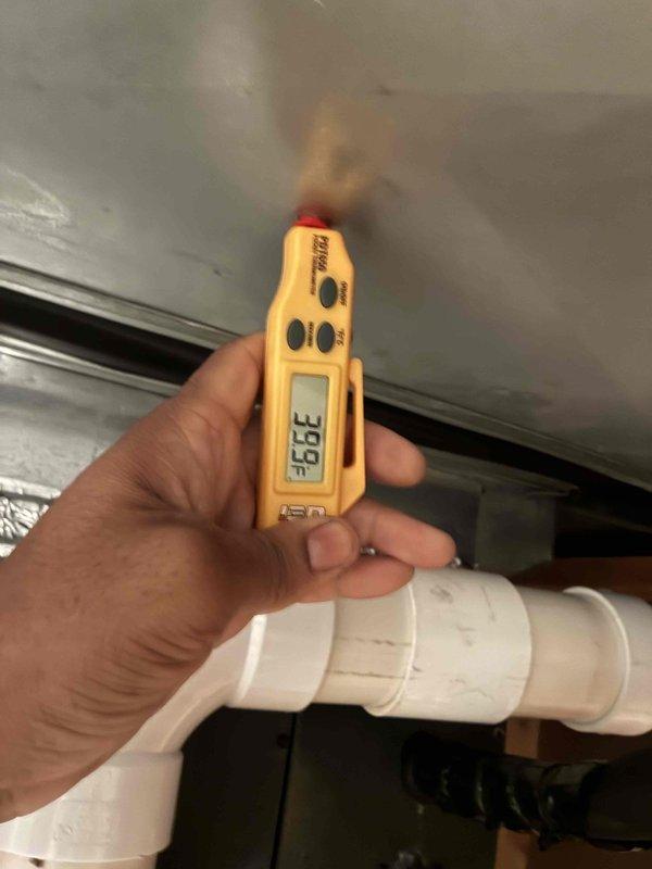 Completed comprehensive cooling maintenance on HVAC system. Performed electrical diagnostics using clamp meter to verify proper amperage and voltage at condensing unit, tested system parameters in mechanical space with digital meter recording temperature reading of 93.9°F. All components inspected and system operating within normal specifications.