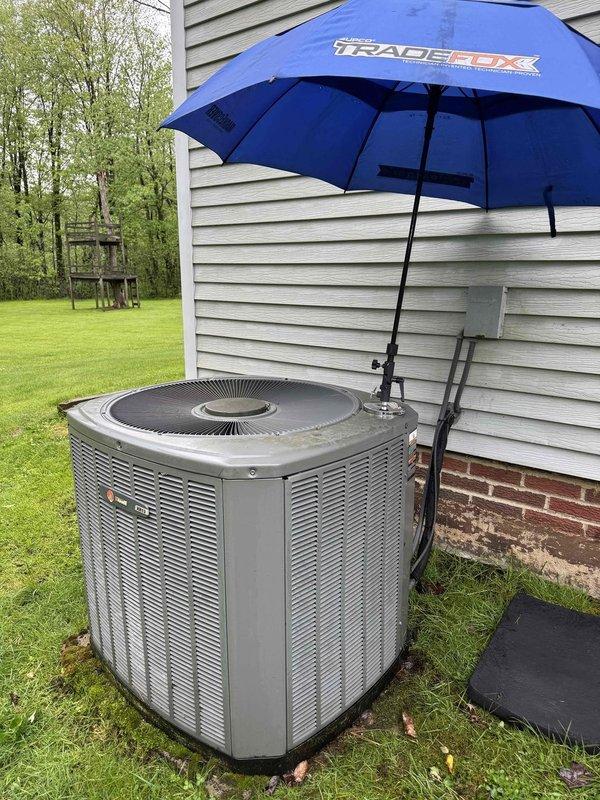 Completed comprehensive cooling system tune-up on residential HVAC unit. Performed standard maintenance procedures including inspection of outdoor condenser unit, verification of thermostat operation displaying 72°F with system in off mode, and confirmed proper fan and cooling settings. All components found operating within normal parameters and system prepared for seasonal cooling demands.