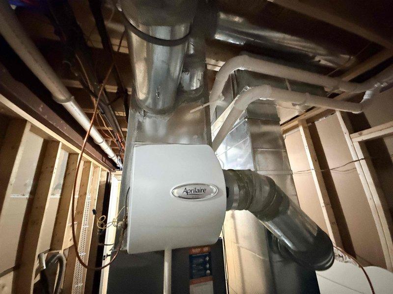 Completed scheduled cooling season preventive maintenance on residential Lennox air conditioning system. Performed comprehensive inspection of outdoor condenser unit and indoor Aprilaire air handler, checked refrigerant levels, tested electrical connections, cleaned condenser coils, verified proper airflow through ductwork, and confirmed all components operating within manufacturer specifications.