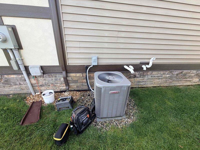 Completed scheduled cooling season preventive maintenance on residential Lennox air conditioning system. Performed comprehensive inspection of outdoor condenser unit and indoor Aprilaire air handler, checked refrigerant levels, tested electrical connections, cleaned condenser coils, verified proper airflow through ductwork, and confirmed all components operating within manufacturer specifications.