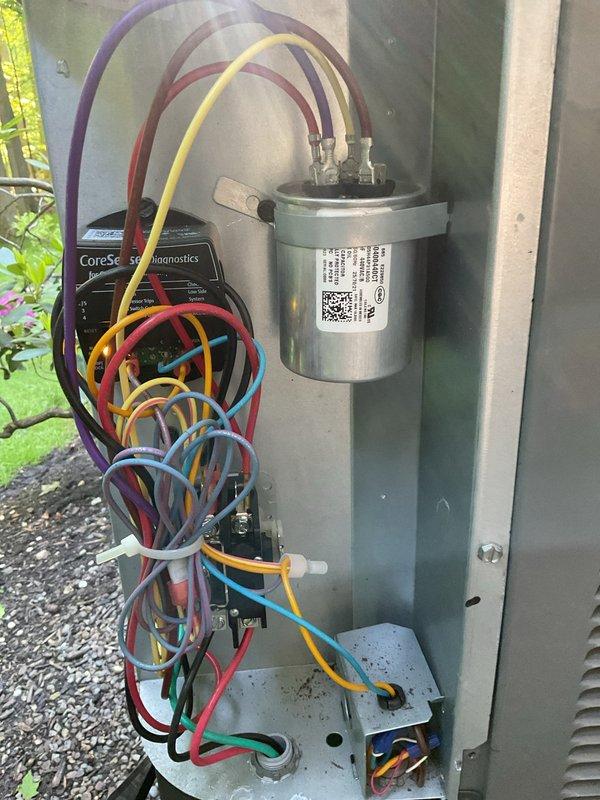 Completed preventive maintenance inspection on dual residential HVAC cooling systems. Performed comprehensive system evaluation including visual inspection of both outdoor condenser units, verified proper capacitor operation and electrical connections, and confirmed CoreSense Diagnostics monitoring system functionality. All components operating within normal parameters with no immediate service needs identified.