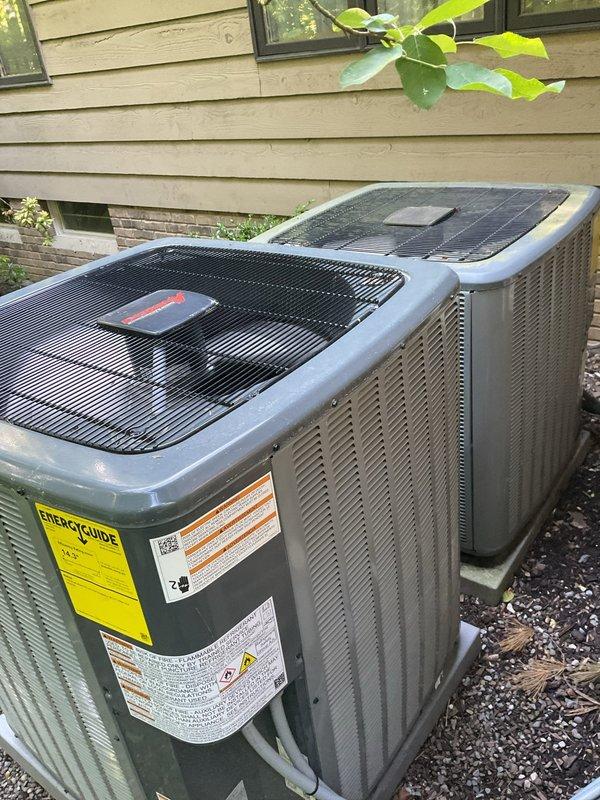 Completed preventive maintenance inspection on dual residential HVAC cooling systems. Performed comprehensive system evaluation including visual inspection of both outdoor condenser units, verified proper capacitor operation and electrical connections, and confirmed CoreSense Diagnostics monitoring system functionality. All components operating within normal parameters with no immediate service needs identified.