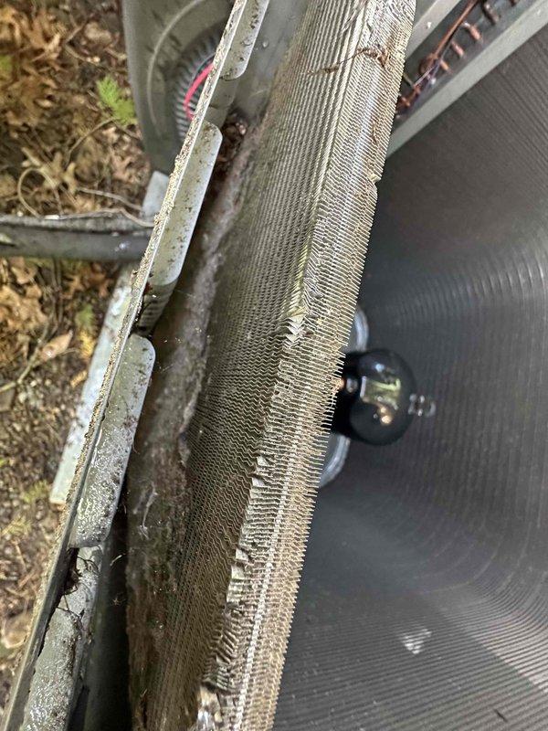 Completed comprehensive maintenance on two HVAC systems including heating and cooling components. Inspected outdoor condenser unit and identified damaged fins on coil requiring attention for optimal airflow and efficiency. Examined condensate drainage system in mechanical space, verifying proper operation and positioning of pump assembly and discharge components to prevent water damage.