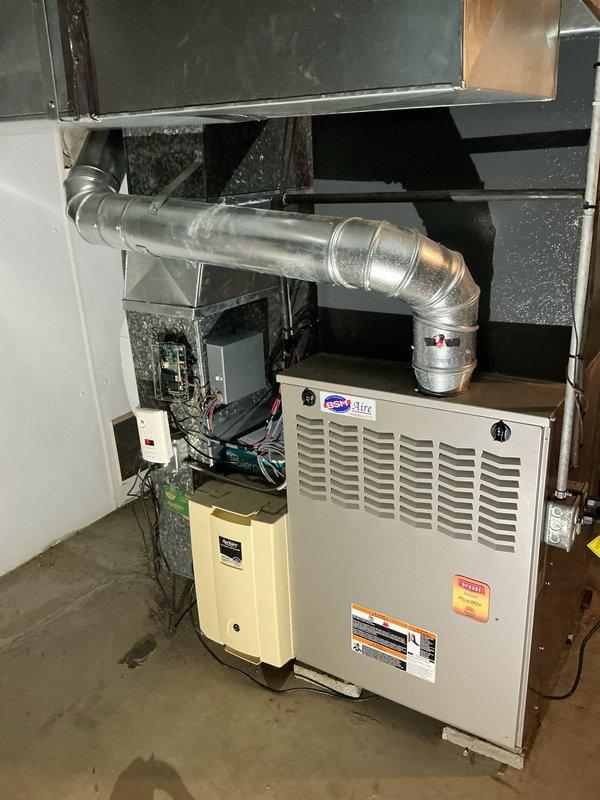 Responded to customer complaint of loud noises from recently installed air conditioning system. Performed thorough inspection of indoor HVAC components including furnace unit, ductwork connections, and humidifier assembly. Examined all mechanical connections, duct transitions, and flexible duct installations for proper securing and potential vibration sources. Documented equipment condition and installation quality through photographic evidence of attic and basement components to verify proper system operation and identify noise source.