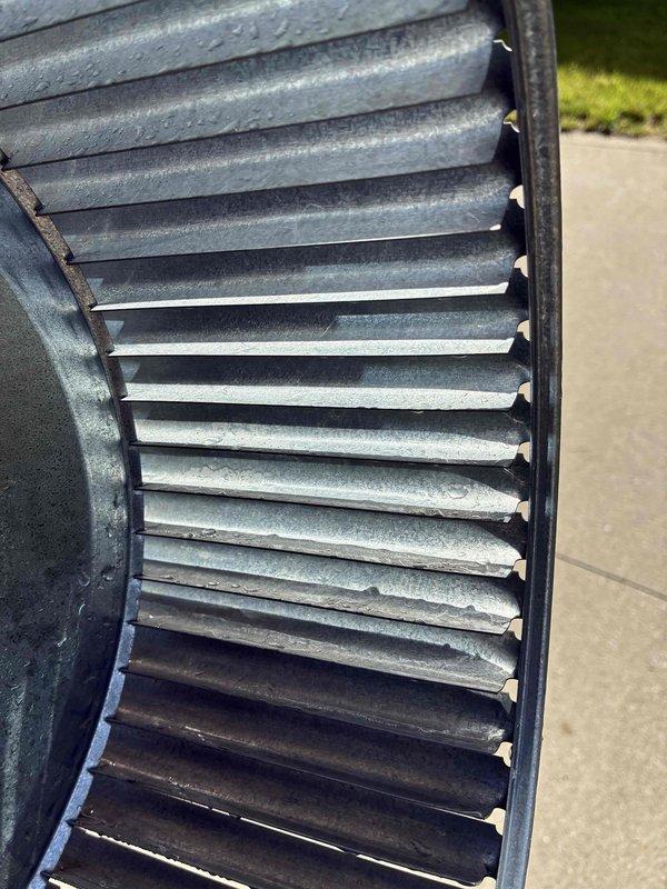 Performed comprehensive cleaning service on residential Ruud air conditioning system. Removed and thoroughly cleaned blower wheel assembly, eliminating accumulated dust and debris from fins and metal surfaces to restore optimal airflow efficiency. Cleaned evaporator coil to improve heat transfer and system performance, ensuring proper operation for continued reliable cooling.