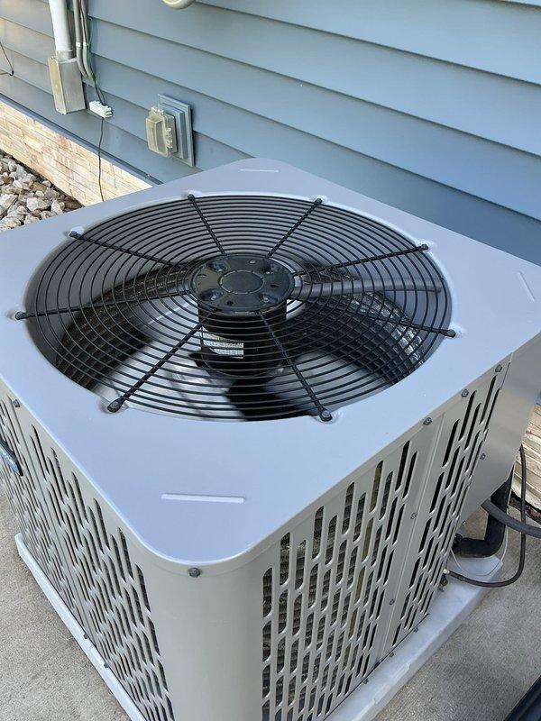 Responded to no cooling complaint on residential air conditioning system. Upon arrival, confirmed outdoor condenser unit was operational with fan running but system not producing cool air. Performed diagnostic inspection of unit exterior and internal control components. Examined circuit boards, wiring connections, and electrical control panel. All visible components including fan motor, control boards, and electrical connections appeared intact and functional. Collected diagnostic fee for service call and system evaluation.