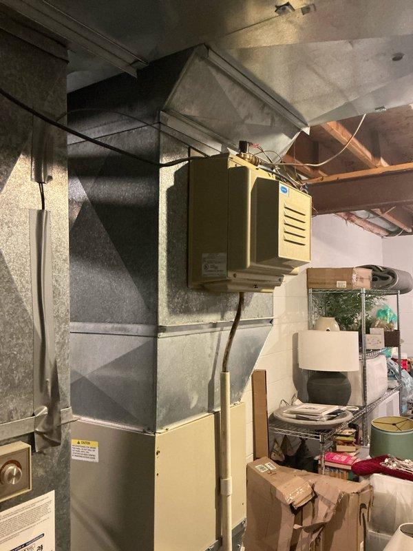 Conducted on-site evaluation of residential HVAC system experiencing refrigerant leak and complete cooling failure. Assessed existing furnace, air handler, ductwork configuration, and condensate drainage system in basement mechanical room. Provided comprehensive replacement estimate for new air conditioning unit and discussed equipment options with property owner.
