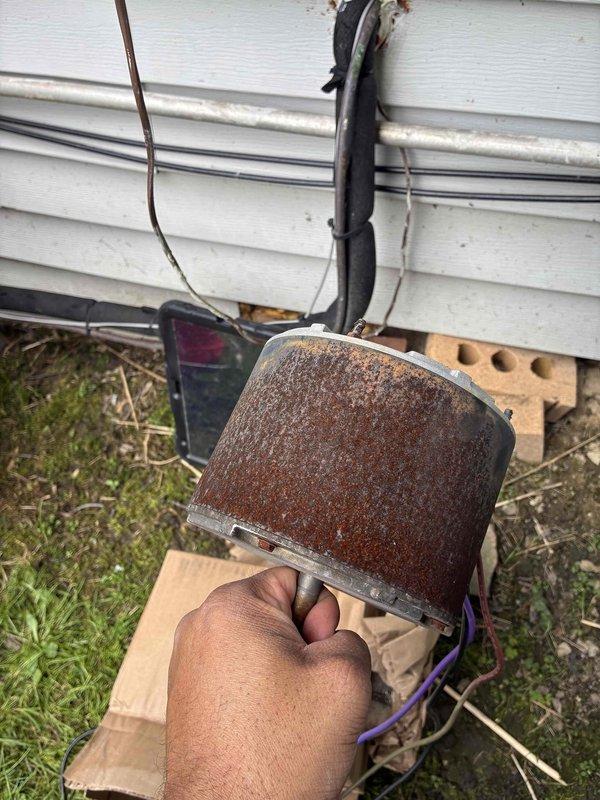 Returned to complete previously diagnosed repair on outdoor condensing unit. Successfully replaced failed dual run capacitor and condenser fan motor. The original motor showed severe corrosion and deterioration, which had caused complete failure of the fan assembly. Removed old corroded motor and installed new OEM replacement motor with proper mounting and electrical connections. Verified proper rotation, amperage draw within specifications, and confirmed unit returned to normal cooling operation. System tested and left running properly.