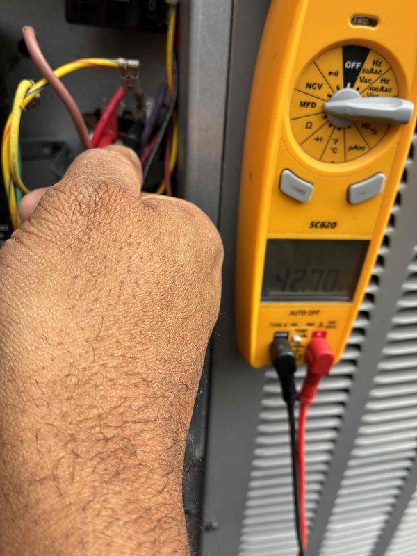 Performed preventive maintenance on Unico high-velocity cooling system. Conducted electrical diagnostics using digital multimeter to verify capacitor readings and system voltage at the air handler unit. Inspected refrigerant lines and electrical connections, confirming all components were operating within manufacturer specifications for continued reliable cooling performance.