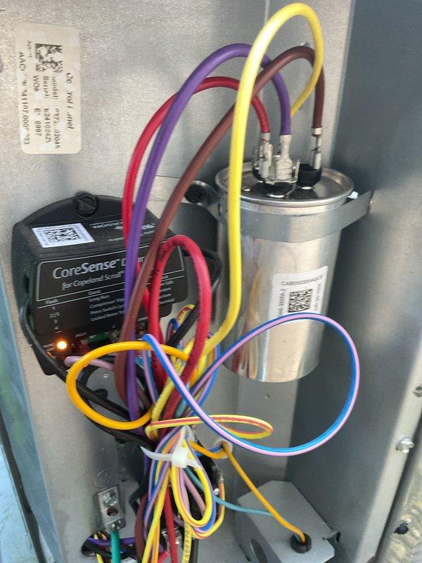 Completed first-year cooling maintenance and MVP A/C tune-up on dual residential condensing units. Performed comprehensive system inspection including electrical connections, capacitor testing, and CoreSense smart control verification on both units, with all components operating within manufacturer specifications.