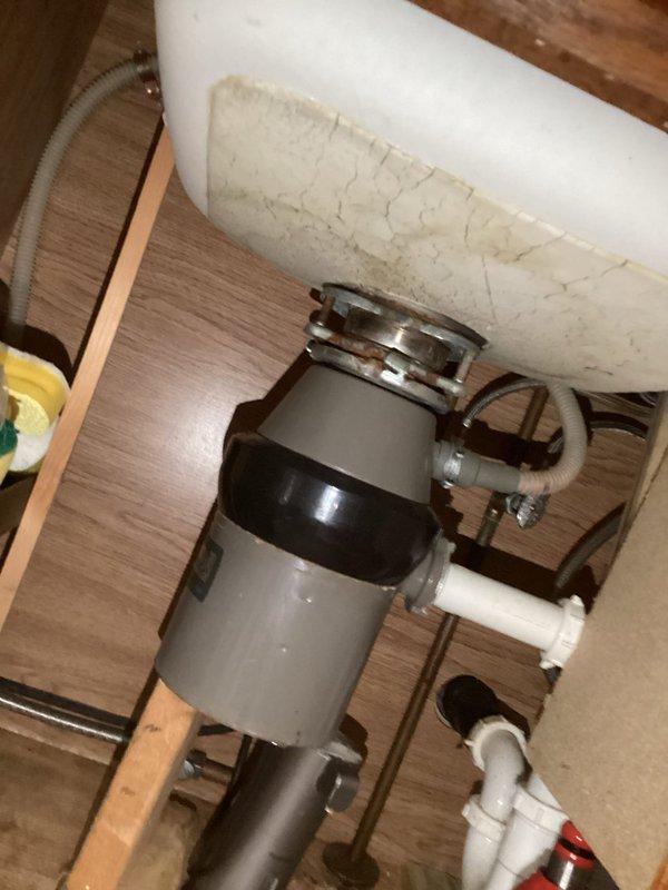 Provided estimate for installation of customer-supplied kitchen faucet in double-basin sink configuration. Assessed existing plumbing setup including undermount stainless steel sink with granite countertop, current faucet with soap dispenser and spray nozzle, and under-sink components including garbage disposal unit and PVC drainage system. Evaluated workspace access and confirmed compatibility for new faucet installation.