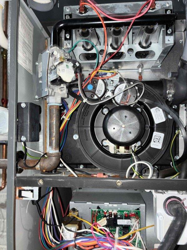 Completed comprehensive MVP cooling system maintenance on residential HVAC unit. Performed standard preventive maintenance procedures including inspection of all mechanical and electrical components, blower motor assembly, gas valve connections, and control board functionality. Verified proper refrigerant temperatures using digital thermometer, recording operating temperature of 67.8°F at the evaporator coil. Inspected copper line connections for oxidation and proper sealing, examined all wire terminations and electrical connections at control board and motor assembly, and confirmed secure mounting of all internal components. All systems tested and operating within normal parameters upon completion of maintenance service.