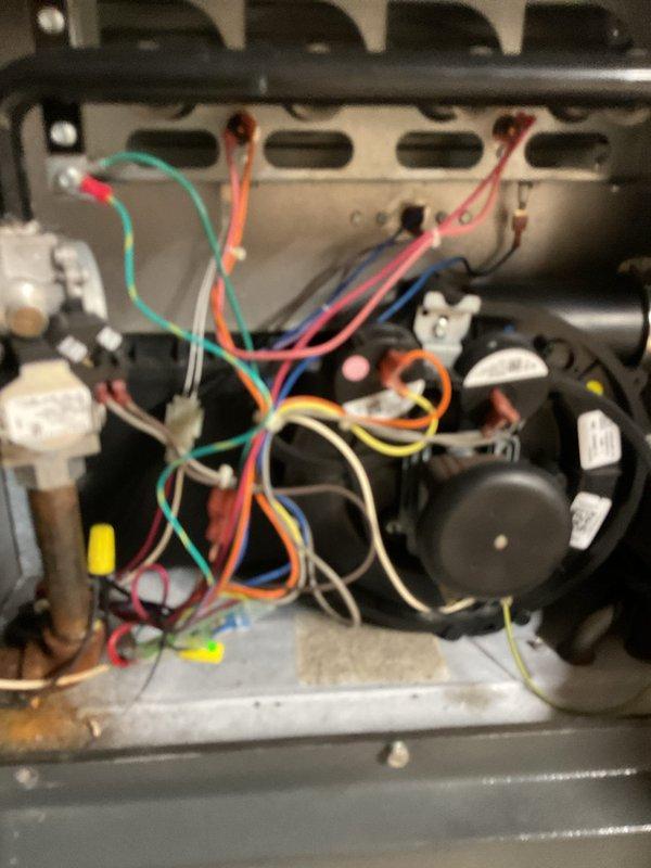 Completed comprehensive cooling system maintenance on residential HVAC unit. Performed thorough inspection of blower motor assembly, verified electrical connections and wiring integrity across all components, and examined refrigerant lines for proper insulation and signs of wear. Checked furnace cabinet housing and associated ductwork connections, confirmed proper operation of all mechanical components, and documented system condition through photographic records for ongoing maintenance tracking.