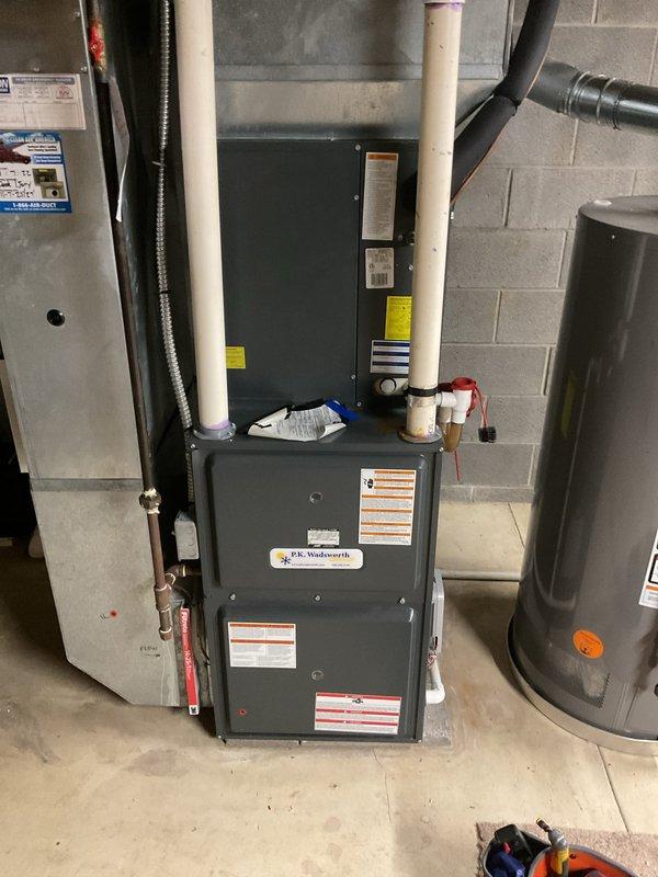 Completed comprehensive cooling system maintenance on residential HVAC unit. Performed thorough inspection of blower motor assembly, verified electrical connections and wiring integrity across all components, and examined refrigerant lines for proper insulation and signs of wear. Checked furnace cabinet housing and associated ductwork connections, confirmed proper operation of all mechanical components, and documented system condition through photographic records for ongoing maintenance tracking.