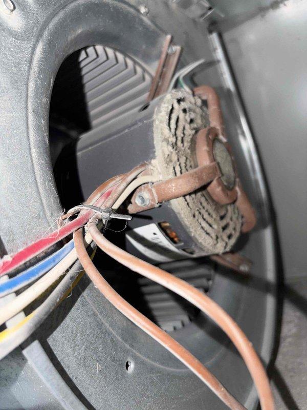 Completed cooling season tune-up on residential HVAC system. Inspected blower motor assembly, electrical connections, and capacitor, noting minor surface oxidation on terminals but all components functioning within normal parameters. Replaced 16x20x4 pleated air filter and verified proper airflow through system.