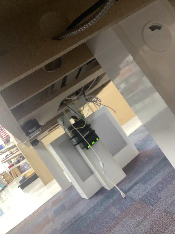 Conducted site assessment of commercial space to provide quote for removal of electrical wiring servicing a table. Inspected exposed ceiling infrastructure, electrical panel with active circuits, and overhead lighting systems to determine scope of work and ensure safe disconnection procedures.