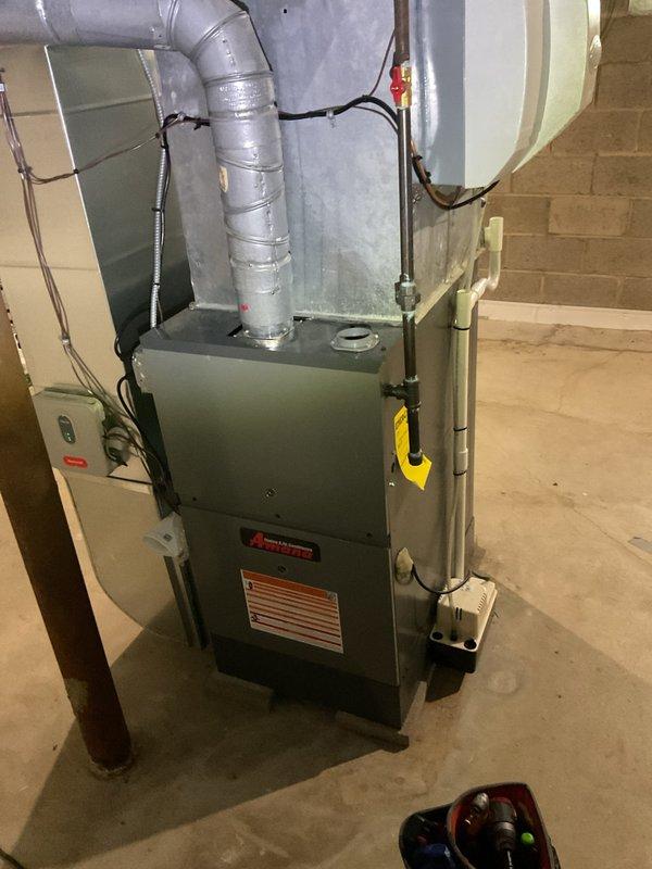 Completed scheduled cooling system maintenance on residential HVAC unit located in basement mechanical room. Performed comprehensive inspection of vertical air handler, ductwork connections, and electrical components. All systems checked and confirmed operational, with metallic ductwork and flex duct connections verified secure and properly installed.