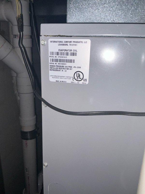 Completed full HVAC system replacement for upstairs zone, including installation of new International Comfort Products evaporator coil in mechanical room and dual outdoor condensing units positioned on gravel pad with proper electrical disconnects and refrigerant line connections. All components installed per manufacturer specifications with appropriate drainage and condensate lines.
