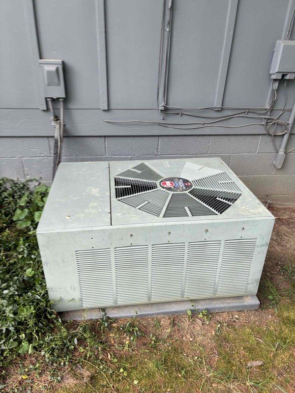 Responded to service call for water accumulation beneath indoor furnace unit during air conditioning operation. Upon arrival, performed diagnostic assessment of aging HVAC system. Inspected outdoor condensing unit and verified operational status. Conducted electrical testing using digital multimeter, obtaining voltage and capacitance readings to assess system performance. Identified condensate drainage issue causing water formation at indoor unit. System evaluated and customer advised of findings regarding older equipment condition.