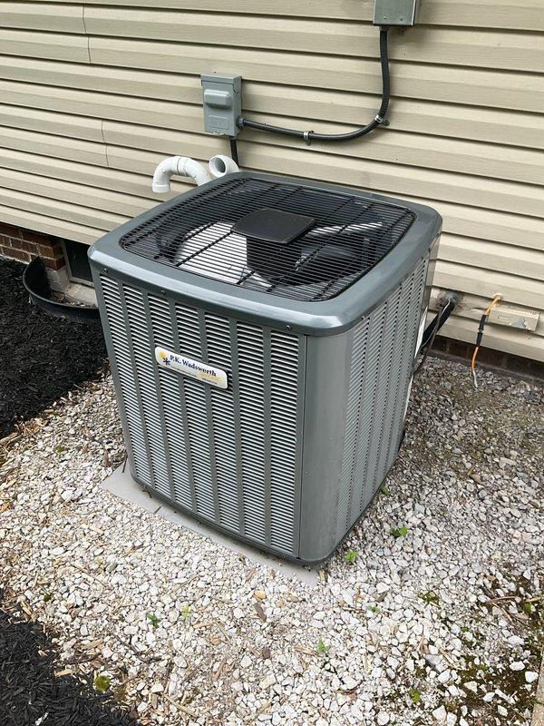 # HVAC Cooling Maintenance Summary

Completed scheduled preventive maintenance service on residential split-system air conditioning unit as part of ongoing maintenance program. Performed comprehensive inspection and servicing of both indoor furnace/air handler system and outdoor condensing unit.

## Work Performed

**Indoor Unit Inspection:**
- Inspected furnace and air handler assembly located in basement mechanical room
- Verified proper operation of Aprilaire humidifier mounted on furnace plenum
- Checked air filter accessibility and ductwork connections
- Examined thermostat/control panel functionality on ductwork
- Inspected PVC condensate drain lines for proper drainage and blockages
- Verified electrical connections and wiring integrity
- Confirmed proper clearances around equipment

**Outdoor Condensing Unit Service:**
- Performed complete inspection of exterior condensing unit positioned on gravel pad
- Cleaned condenser coils and removed debris from unit
- Inspected fan motor