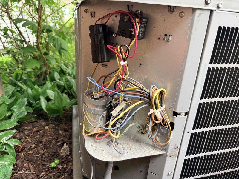# HVAC Cooling Maintenance Summary

Completed routine preventative maintenance on outdoor condensing unit as part of recurring cooling system service. Performed comprehensive inspection of electrical components including capacitor, contactor, and associated wiring connections within the service compartment.

# Detailed Service Description

Arrived at property and accessed outdoor air conditioning condensing unit for scheduled preventative maintenance visit. Removed service panel to expose electrical compartment and internal components for thorough inspection and servicing.

Inspected electrical connections, capacitor, and contactor assembly. Noted weathering and age-related discoloration on some wiring, consistent with outdoor exposure over time. Observed rust and corrosion on interior metal surfaces of the electrical compartment, typical of units exposed to outdoor elements. All electrical components were evaluated for proper operation and secure mounting.

Examined refrigerant line s