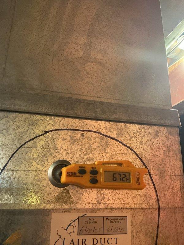 # HVAC Cooling Maintenance Summary

Completed preventive maintenance service on residential AirTemp cooling system as part of recurring maintenance agreement. Performed comprehensive inspection of air handler unit, verified proper operation of all components, and tested system performance. Measured and documented temperature differentials using calibrated digital instrumentation, recording 6.12-degree reading to verify adequate cooling capacity and airflow. All equipment found operating within manufacturer specifications with no deficiencies noted.

# Detailed Service Report

Performed scheduled cooling system maintenance on residential AirTemp HVAC equipment located in basement mechanical room. Conducted thorough visual inspection of air handler and furnace assembly, examining all manufacturer labels, safety warnings, and specification plates for compliance documentation.

Inspected condensate drainage system including white PVC piping for proper pitch, secure connections, and clear f