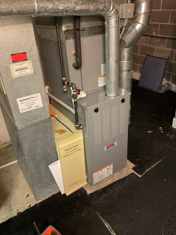 # HVAC Cooling Maintenance Summary

Performed comprehensive cooling system maintenance on residential Heil furnace unit located in basement mechanical room. Inspected all accessible components including ductwork connections, electrical panel operations, and refrigerant line connections with valves and copper piping.

# Detailed Work Performed

Conducted thorough visual inspection of the gray Heil furnace cabinet and associated cooling system components. Verified proper installation and clearances of all galvanized metal ductwork extending from unit, including elbow joints and horizontal runs. Examined insulated ductwork for any signs of deterioration or separation at connection points.

Inspected electrical panel and associated wiring connections for proper voltage and amperage readings. Verified all safety switches and controls were functioning within manufacturer specifications. Checked cream-colored auxiliary component box for proper operation and secure mounting.

Evaluated copper 