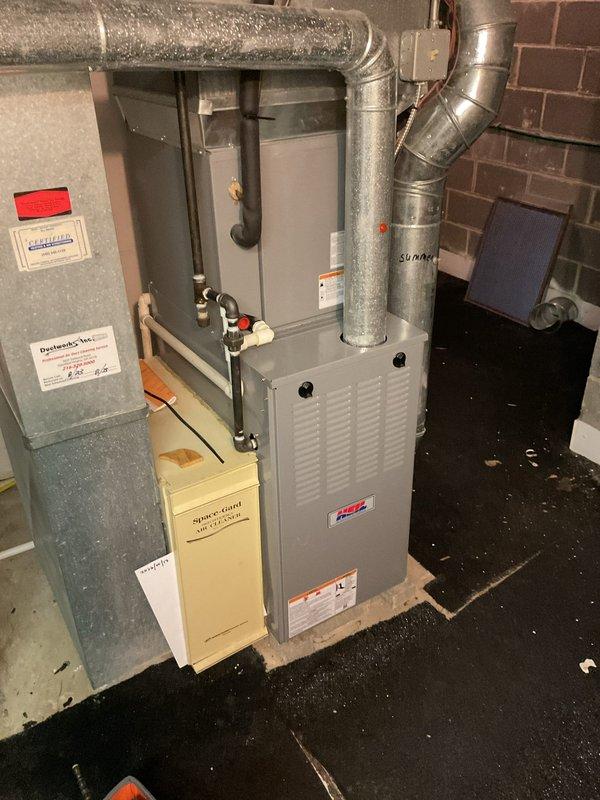 # HVAC Cooling Maintenance Summary

Performed comprehensive cooling system maintenance on residential Heil furnace unit located in basement mechanical room. Inspected all accessible components including ductwork connections, electrical panel operations, and refrigerant line connections with valves and copper piping.

# Detailed Work Performed

Conducted thorough visual inspection of the gray Heil furnace cabinet and associated cooling system components. Verified proper installation and clearances of all galvanized metal ductwork extending from unit, including elbow joints and horizontal runs. Examined insulated ductwork for any signs of deterioration or separation at connection points.

Inspected electrical panel and associated wiring connections for proper voltage and amperage readings. Verified all safety switches and controls were functioning within manufacturer specifications. Checked cream-colored auxiliary component box for proper operation and secure mounting.

Evaluated copper 