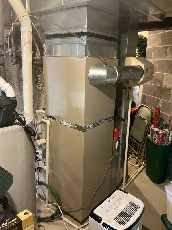 Conducted comprehensive estimate consultation for full HVAC system replacement in residential basement installation. Reviewed previous quote from September 2025 with customer who approved moving forward with originally proposed equipment and scope of work. Assessed existing furnace and ductwork configuration, documented current system layout including metallic ductwork connections, air filtration components, and utility clearances for proper replacement planning and code compliance.