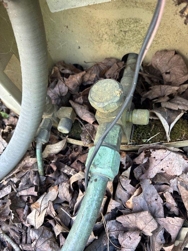 Conducted on-site evaluation for complete HVAC system replacement and provided two comprehensive replacement options. Assessment included inspection of existing electrical service panel to verify adequate capacity and circuit availability for new equipment installation. Evaluated outdoor unit location and associated refrigerant line set connections, noting significant corrosion and oxidation on existing copper tubing and brass fittings. Documented current system conditions including weathered outdoor components and deteriorated service valves requiring replacement. Prepared detailed replacement proposals addressing electrical requirements, outdoor unit placement, and complete refrigerant piping system renewal to ensure proper system performance and longevity.