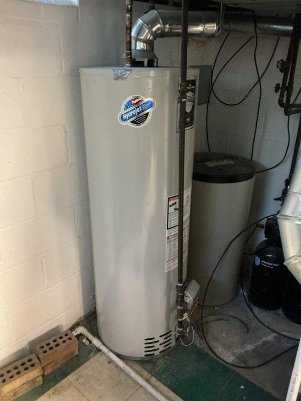 # HVAC Cooling Maintenance Summary

Completed scheduled preventive maintenance on residential cooling system as part of ongoing service plan. Performed comprehensive inspection of HVAC equipment located in utility room, including evaluation of air handler, ductwork connections, and associated mechanical components. Documented current system conditions through photographic records showing utility room layout with water heater, ductwork configuration, and mechanical equipment positioning.

# Detailed Service Description

Conducted routine cooling system maintenance visit in residential utility space. Upon arrival, performed visual inspection of the mechanical room to assess overall equipment condition and accessibility. The service area contained standard residential utilities including water heating equipment, plumbing systems, and HVAC ductwork.

Inspected metallic ductwork extending from air handler unit, noting galvanized construction with curved elbow joints and proper connection po