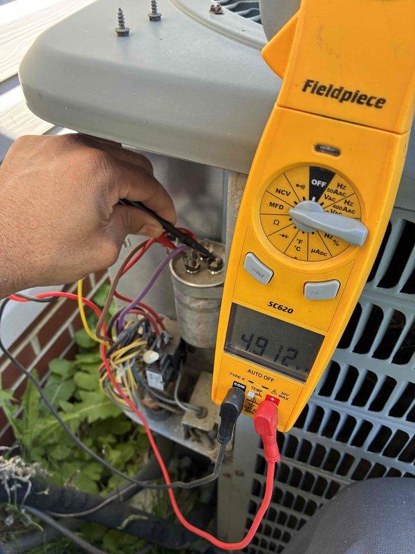 Completed comprehensive cooling tune-up service on three HVAC units. Performed electrical diagnostics using precision testing equipment, measuring voltage and amperage readings at each unit's electrical compartment to verify proper system operation. Inspected and tested capacitors, checked all wire connections and terminals for secure contact, and evaluated condenser unit components. All three systems tested within normal operating parameters and are functioning efficiently for the cooling season.