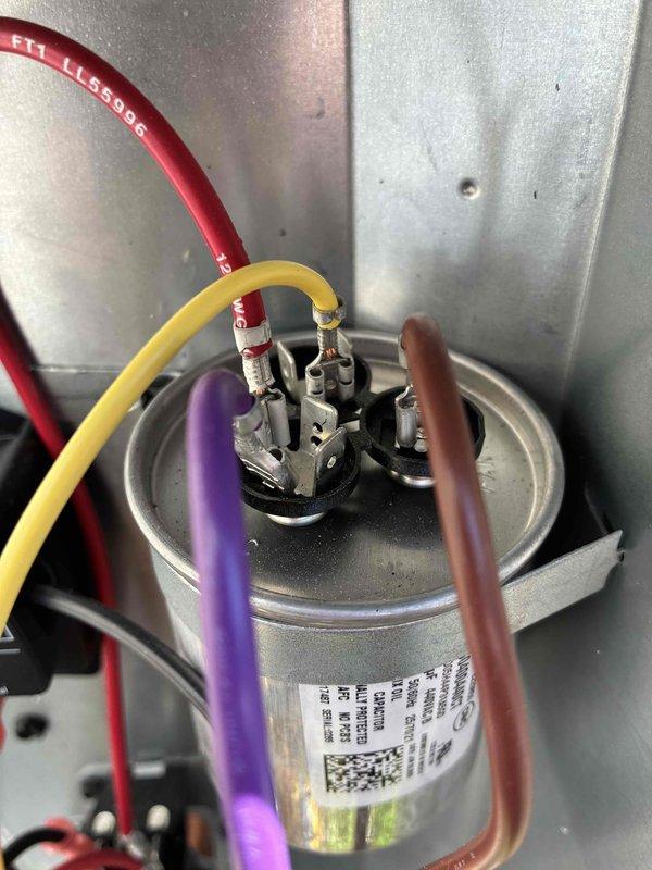 Completed comprehensive cooling system maintenance inspection. Verified capacitor integrity and electrical connections, confirming proper wire terminations and secure mounting within the condensing unit housing. Performed diagnostic testing using digital multimeter to measure capacitance values, ensuring capacitor is functioning within manufacturer specifications for optimal compressor and fan motor operation.