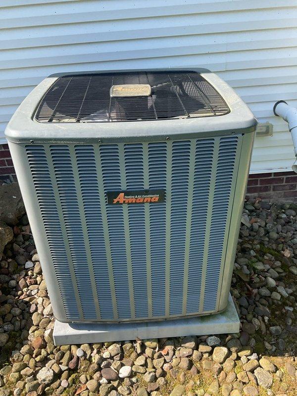 Completed scheduled preventive maintenance on residential cooling system including Amana outdoor condenser unit and indoor air handler with integrated Aprilaire humidifier. Performed comprehensive inspection of outdoor unit, verified proper refrigerant levels, cleaned condenser coils, checked electrical connections, and confirmed fan motor operation. Inspected indoor components including air handler, ductwork connections, and humidity control system to ensure optimal performance for the cooling season.
