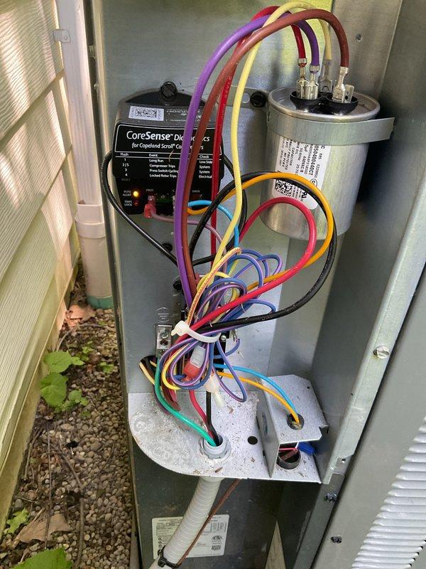 Performed comprehensive cooling system maintenance on outdoor condensing unit and indoor air handler. Conducted diagnostic testing of electrical components using multimeter, verified capacitor operation and compressor functionality with CoreSense monitoring device. Replaced heavily soiled air filter that showed significant dust and debris accumulation, which was restricting airflow and reducing system efficiency. All electrical connections tested and verified within normal operating parameters, system operational upon completion.