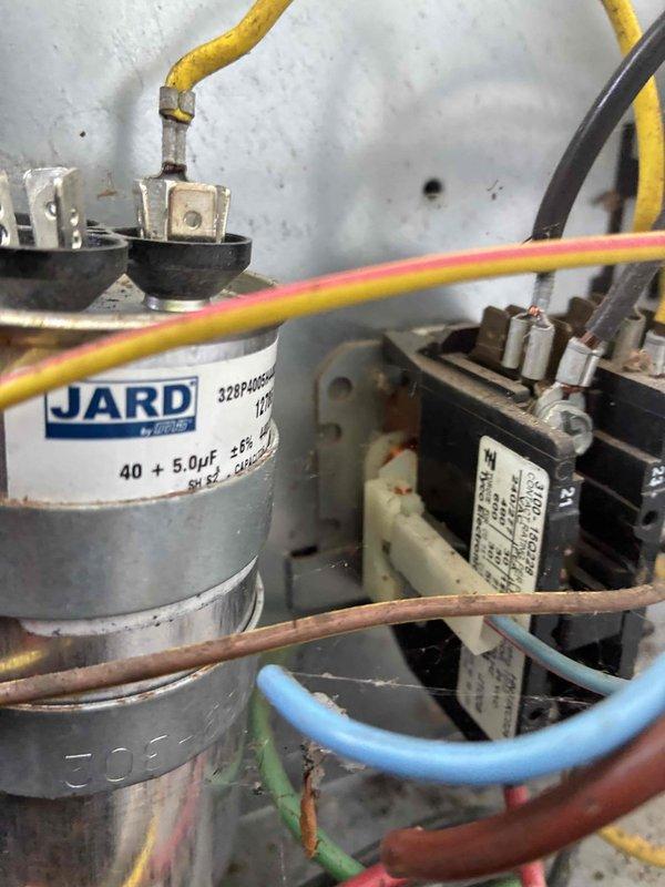 Completed comprehensive HVAC cooling system maintenance on outdoor condensing unit, including inspection of electrical components, capacitor testing, contactor operation verification, and fan motor assembly evaluation. Also performed hot water tank maintenance as part of scheduled preventive maintenance visit.